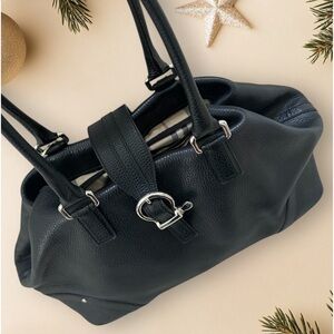 Burberry black pebbled leather shoulder bag. Plaid interior, snap closure.